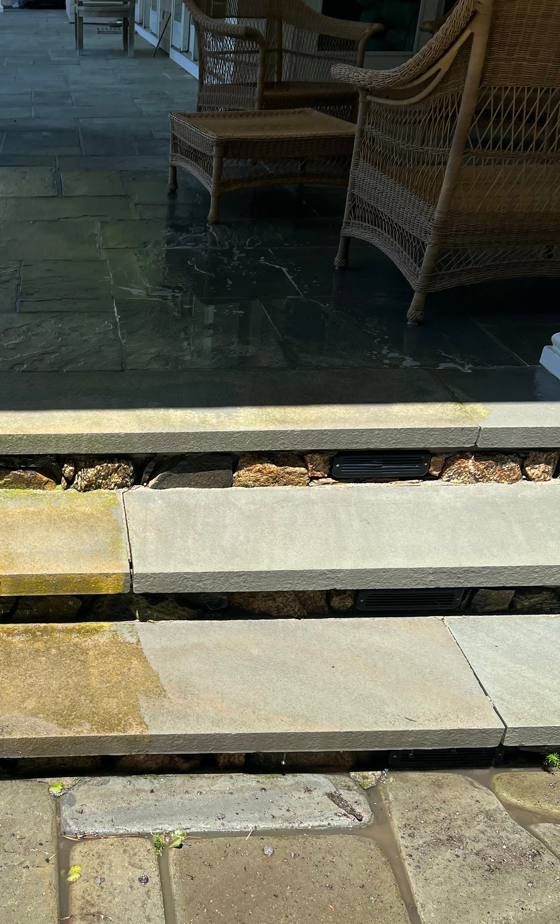 Clean stone patio steps after professional pressure washing